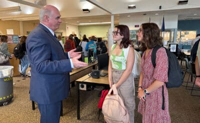 Speaker Kevin Cassidy speaking with students at high school